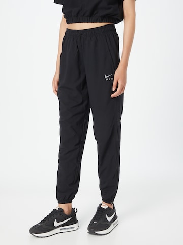 NIKE Tapered Sports trousers in Black: front