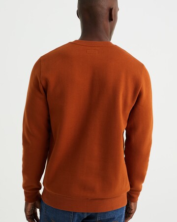 Sweat-shirt WE Fashion en orange
