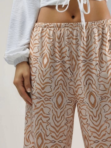 Hiccup Tapered Trousers in Beige