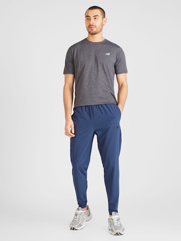 new balance Конический (Tapered) Спортивные штаны 'Essentials Active S' в Синий