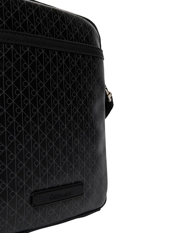 Calvin Klein Crossbody bag 'EMBLEM AOP COATED SLIM REPORTER LV04D3334G' in Black
