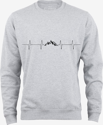 Cotton Prime Sweatshirt 'Pulsschlag Berge' in Grijs: voorkant