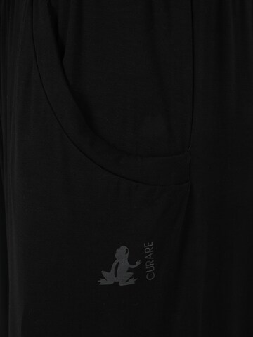 CURARE Yogawear - Tapered Calças de desporto em preto