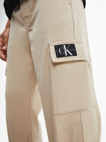 smėlio Calvin Klein Jeans Siaurėjantis Kelnės