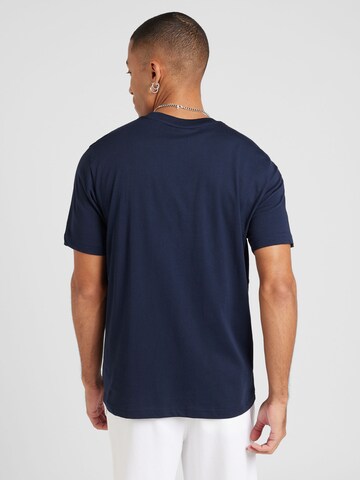 Maglietta di Champion Authentic Athletic Apparel in blu