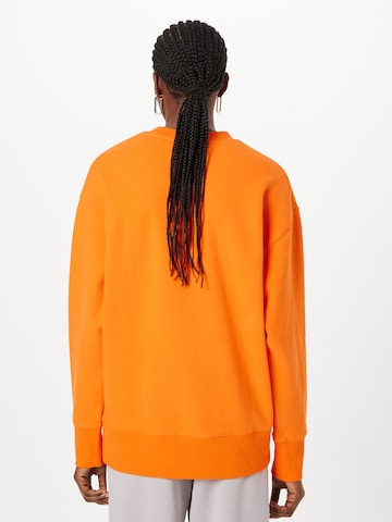 Superdry - Sudadera en naranja