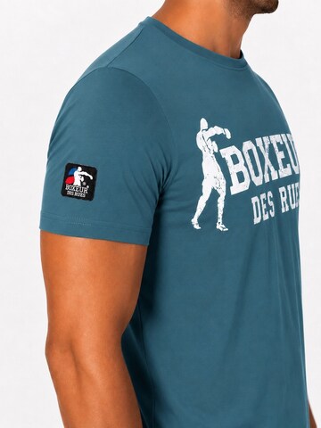 Boxeur des Rues - Camiseta 'Herren T-Shirt Slim Fit Boxeur des Rues, Ozeanblau, Weißes Logo, Premium-Baumwolle' en azul