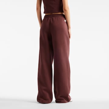 Wide leg Pantaloni 'Trackside' di new balance in rosso