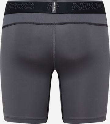 NIKE Skinny Sportunterhose in Grau