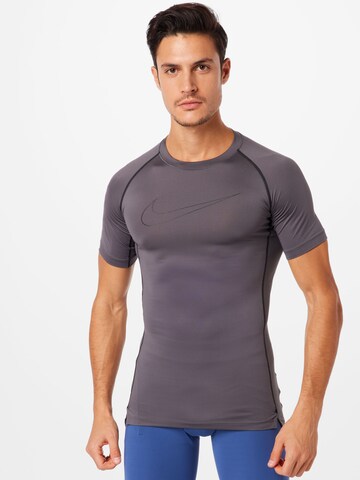 NIKE - Camisa funcionais 'Pro' em cinzento: frente