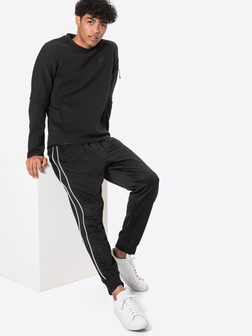 Bluză de molton de la Nike Sportswear pe negru