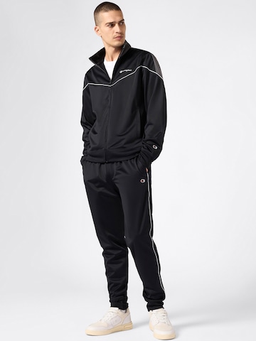 juoda Champion Authentic Athletic Apparel Treniruočių kostiumas: priekis