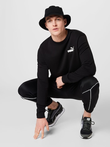 PUMA Sportsweatshirt 'Essentials' in Zwart