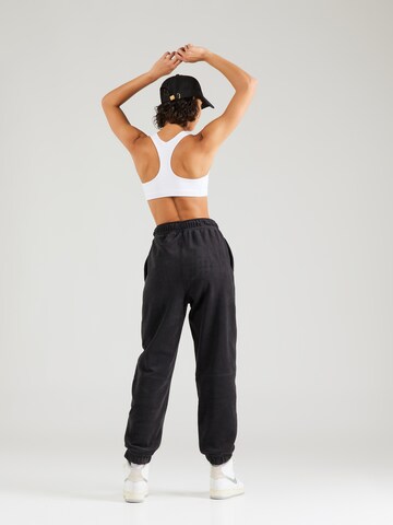 NIKE Tapered Sportbroek 'ONE' in Zwart