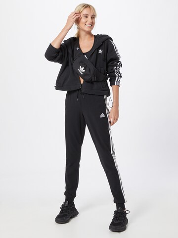 ADIDAS SPORTSWEAR Конический (Tapered) Спортивные штаны 'Essentials' в Черный