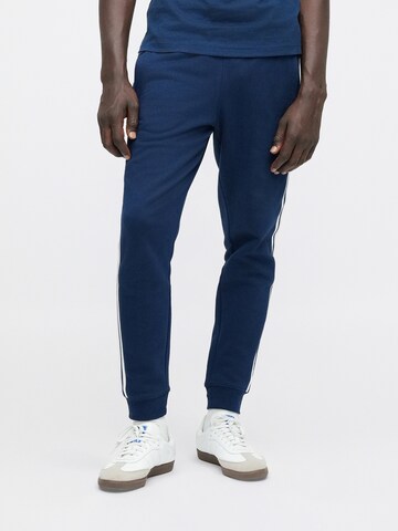 Effilé Pantalon ADIDAS ORIGINALS en bleu : devant