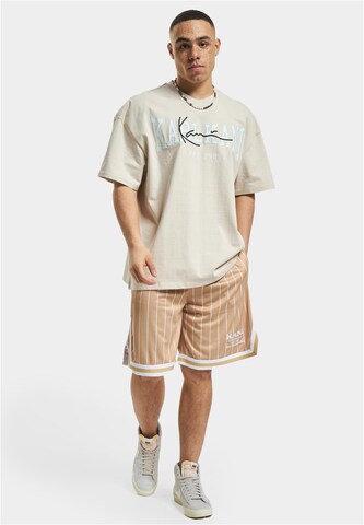 Karl Kani Loose fit Trousers in Beige