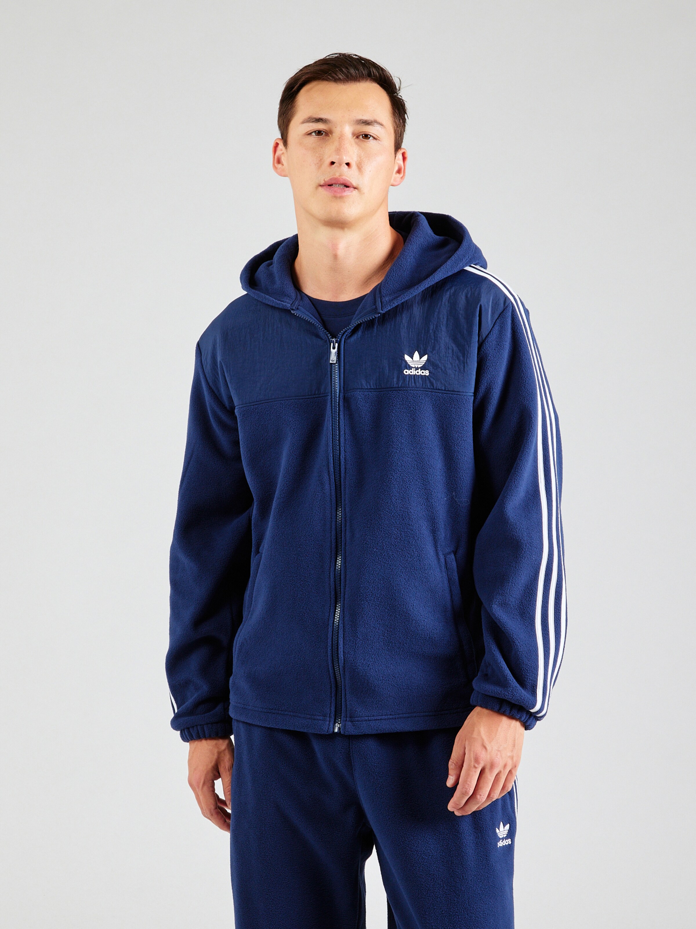 Veste de survetement Adicolor ADIDAS ORIGINALS en Marine ABOUT YOU