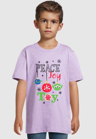 ABSOLUTE CULT Shirt 'Toy Story - Xmas Peace Joy Toy Basic Tee 2.0' in Lila: voorkant