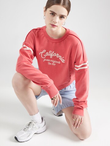 Sweat-shirt GUESS Originals en orange : devant