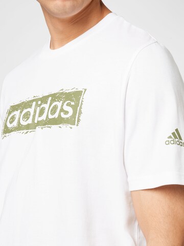 ADIDAS SPORTSWEAR - Camiseta funcional 'Sketch Linear Graphic' en blanco