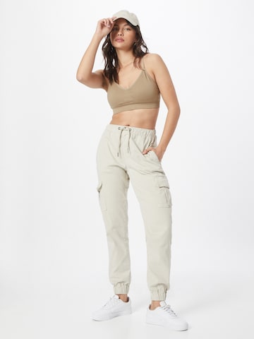 Effilé Pantalon cargo Urban Classics en beige