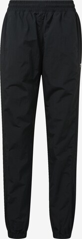Pantaloni de la Reebok Classics pe negru: față