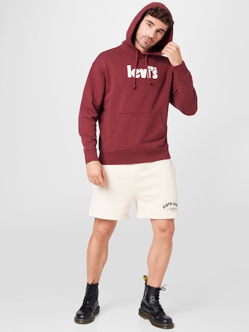 sarkans LEVI'S ® Standarta piegriezums Sportisks džemperis 'Relaxed Graphic Hoodie'