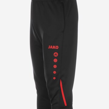 Effilé Pantalon de sport JAKO en noir