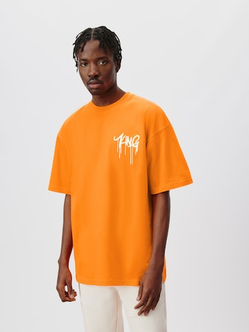 ABOUT YOU x Kingsley Coman Koszulka 'Aaron' w kolorze pomarańczowy: przód