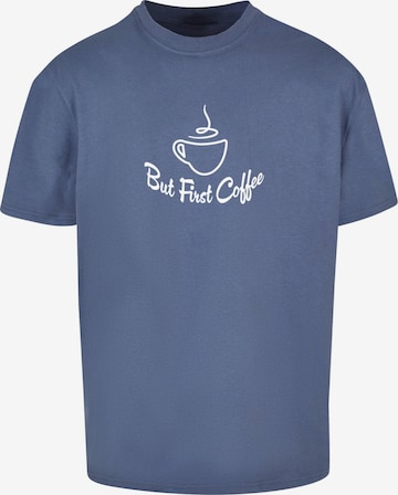 Merchcode Shirt 'But First Coffee' in Blauw: voorkant