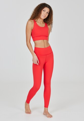 Athlecia Skinny Sports trousers 'Franz' in Orange