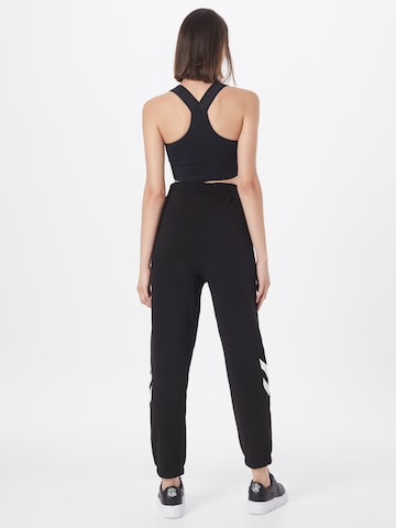 Effilé Pantalon de sport Hummel en noir