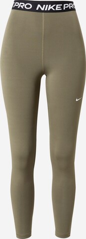 NIKE Workout Pants in Green: front