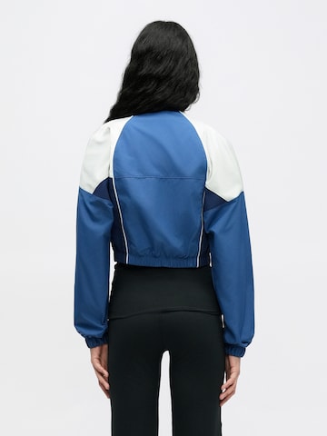 Nike Sportswear Átmeneti dzseki 'SHRUNKEN' - kék