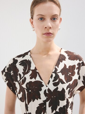 Salopeta 'Simba' de la MANGO pe bej