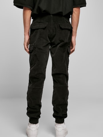 Urban Classics Loose fit Cargo trousers in Black