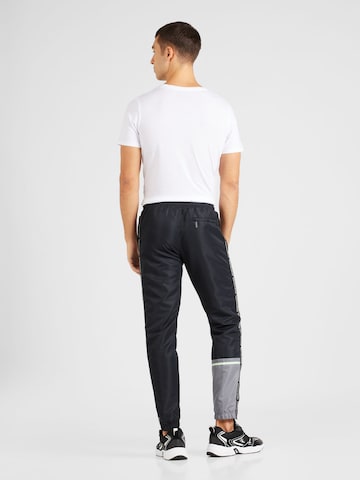 Sergio Tacchini - Tapered Pantalón deportivo 'MIDDAY' en negro