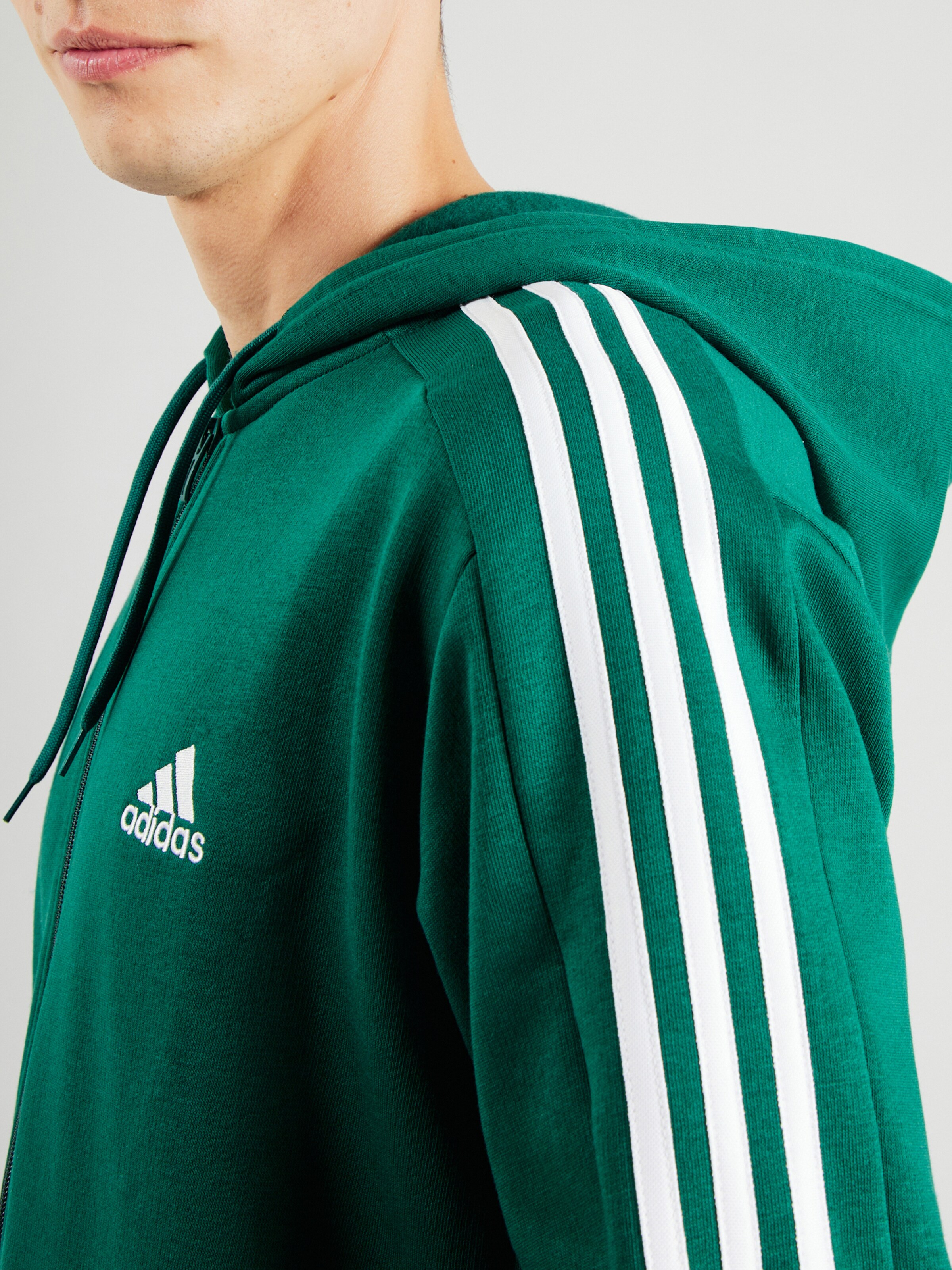 ADIDAS SPORTSWEAR Athletic Zip Up Hoodie Essentials in Green ABOUT YOU