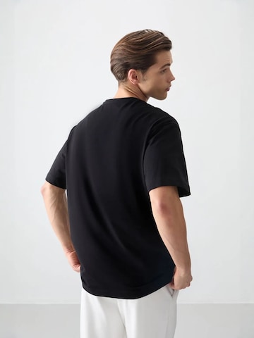 Tommy Life T-Shirts in Schwarz
