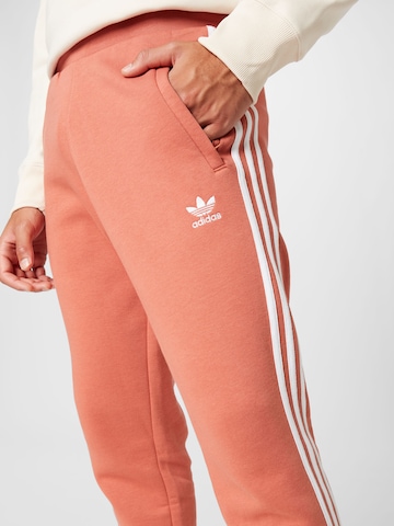 ADIDAS ORIGINALS Zúžený Kalhoty 'Adicolor Classics 3-Stripes' – pink