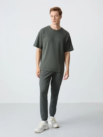 Survêtement Tommy Life en vert : devant