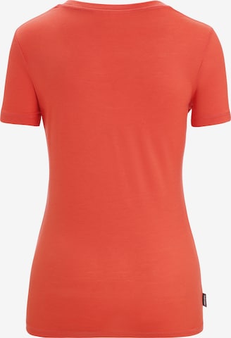 ICEBREAKER Toiminnallinen paita 'Scoop Plume' värissä oranssi