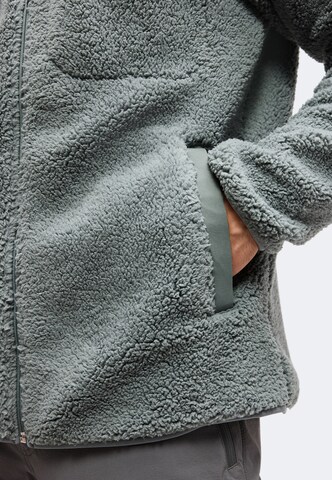 COLUMBIA Urheilullinen collegetakki 'Rugged Ridge™' värissä vihreä