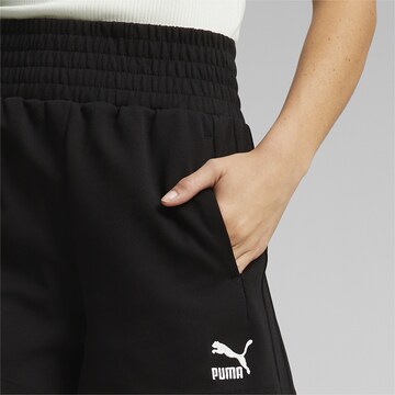 PUMA Regular Workout Pants 'T7' in Black