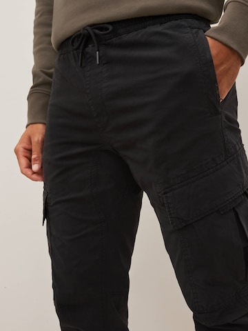 Next Slimfit Cargobroek in Zwart