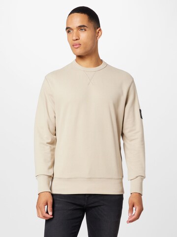 Sweat-shirt Calvin Klein Jeans en beige : devant