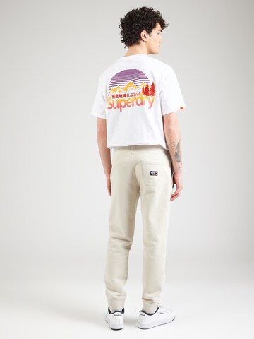 Superdry Zwężany krój Spodnie 'Essential' w kolorze beżowy
