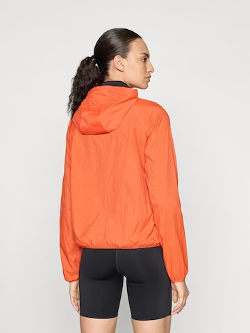 NIKE Sportovní bunda – červená