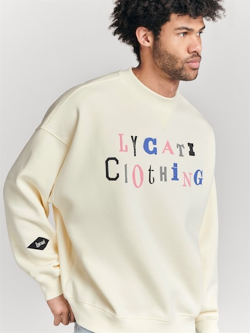 Sweat-shirt LYCATI exclusive for ABOUT YOU en blanc